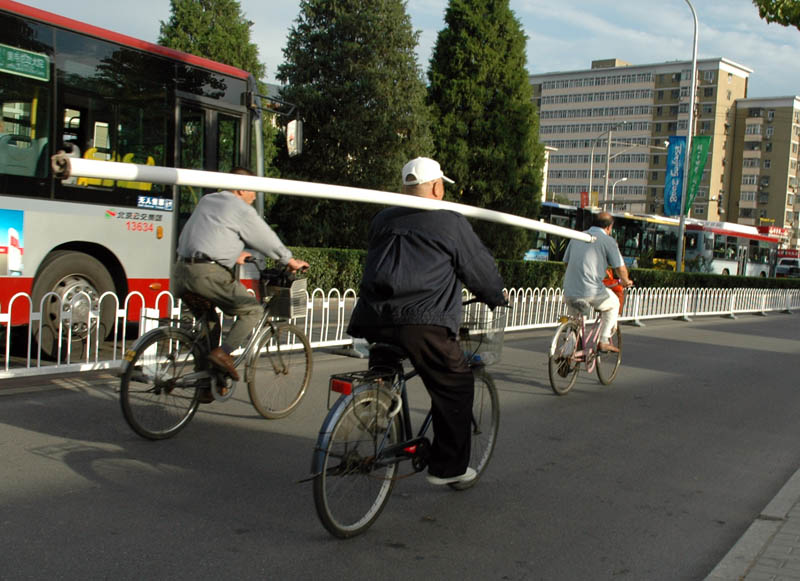 He smiled proudly at me, when I took this picture. A large number of people still use bicycles in Beijing